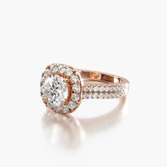 an engagement ring with two rows of diamonds on top and bottom, set in 18k rose gold