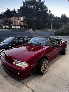 a red sports car parked in a parking lot