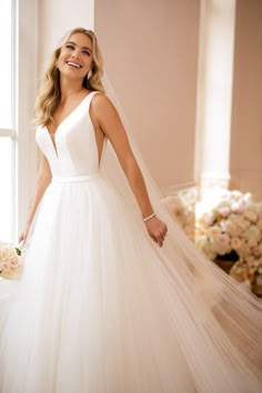 a woman wearing a wedding dress and veil