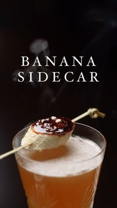 the banana sidecar cocktail is garnished with an ice cream and cinnamon stick