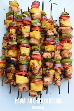 the skewers are piled high on top of each other and ready to be grilled