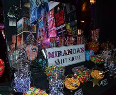 the candy bar has many different types of candies and sweets on display for everyone to enjoy