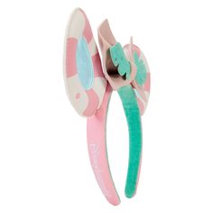 Dreaming of the perfect vacay? Check-in for your next getaway with the Loungefly Minnie Mouse Vacation Style Ear Headband. Bask in the sunshine with die-cut ears in the shape of pool floaties – you’ll even see daylight reflect off the water in the center of each ear! A tropical leaf cinches the headband’s pastel pink bow, which can be removed to accommodate personal style preferences. This accessory adds an air of relaxation to any outing and will keep you looking stylish throughout your stay.Die-cut headband is made of vegan leather (polyurethane). Additional features include applique, PVC, detachable 3D bow, and printed details. An embroidered Loungefly logo appears on the side of the band.This headband is an officially licensed Disney product.One size fits most.Headband dimensions: 8.85 Pool Floaties, Stylish Headbands, Style Headband, Accessories Ear, Pvc Panels, Leather Headbands, Loungefly Disney, Minnie Mouse Ears, Ears Headband