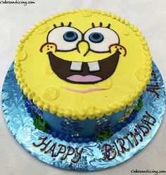 a birthday cake with the face of a cartoon character on it