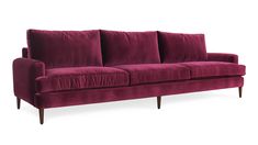 a red velvet couch with wooden legs and arm rests on an isolated white background,