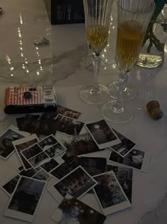 wine glasses and photographs on a table