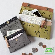 two small purses with money and coins in them