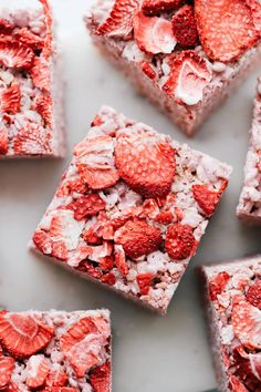 strawberry shortcakes with white frosting and strawberries on top, arranged in squares