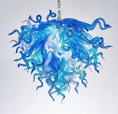 a blue and white light hanging from a chain