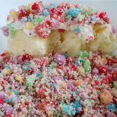 a cake with sprinkles on it is cut in half