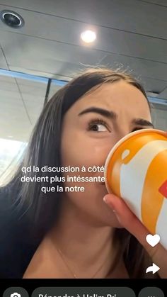 a woman drinking out of a cup with the caption'qd la discussion a cot devent plus intessante ques? que la note '