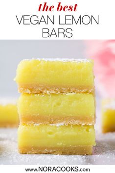 three lemon bars stacked on top of each other with the words vegan lemon bars above them