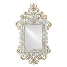 an ornate mirror with shells and pearls on the frame, isolated against a white background