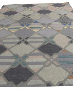 a multicolored area rug with squares on it