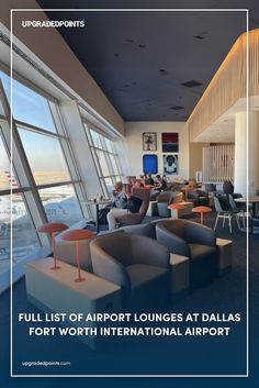 Interior of an airport lounge at Dallas Fort Worth International Airport, featuring sleek seating areas with modern gray and orange chairs, individual side tables, and large windows offering a view of parked American Airlines planes.