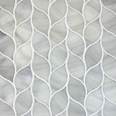 an abstract white background with wavy lines and curves on the fabric in shades of grey