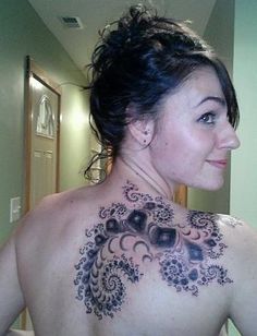 a woman with a tattoo on her back