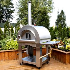 The Italian inspired PINNACOLO PREMIO is built for years of reliable performance while providing you with fabulous wood fired flavor. The well insulated double-walled dome and matching cart are built of heavy gauge stainless steel. The Cordierite cooking surface offers great heat retention, thermal shock resistance and enough space for 2-3 pizzas at once. A convenient stainless steel side shelf is ready for easy prep. There is secure fitting door, a built-in thermometer, hangers ready for your c Pizza Tumblr, Pizza Photography, Aesthetic Pizza, Pizza Aesthetic, Portable Pizza Oven, Recipes Pizza, Wood Burning Pizza Oven, Dough Pizza, Brick Hearth