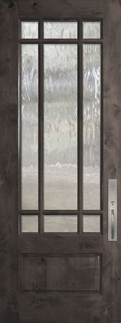 the front door is made of wood and has frosted glass on the window panes