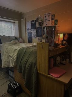 a bed room with a neatly made bed next to a window