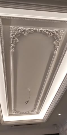 the ceiling in this room is decorated with white paint