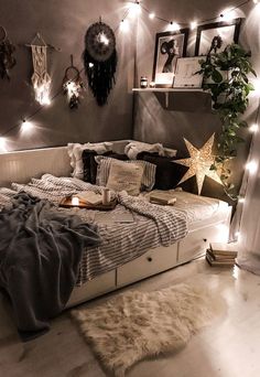 a bed room with a neatly made bed and lots of lights