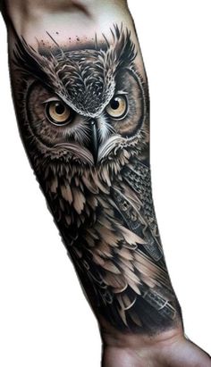 an owl tattoo on the arm