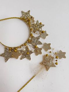 This handmade accessory is a stunning, delicate headband adorned with a sparkling star centerpiece. The star, covered in shimmering gold glitter, radiates elegance and whimsy, making it perfect for special occasions or to add a magical touch to any outfit. Surrounding the star are intricate wire details featuring soft pink and pearl-like beads, giving the piece a dreamy, celestial vibe. Ideal for Christmas , parties, or simply standing out with a unique, handcrafted look, this headband combines beauty and sophistication, turning heads wherever you go. These Accessories are not a toy, so please supervise any child during use All our products are 100% handmade cut and finished from start to finish. all designed in house Shipping On all of our products you will see a shipping time when you pu Star Tiara, Headband Beaded, Star Centerpieces, Beaded Star, Star Headband, Sparkling Stars, Star Hair, Gold Headband, Christmas Parties