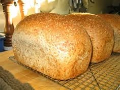 two loaves of bread cooling on a rack