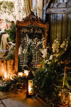 a table with flowers and candles on it