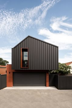 a modern house with an open garage door