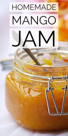 homemade mango jam in a glass jar with a spoon on the side and text overlay that reads homemade mango jam