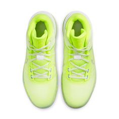 a pair of neon green sneakers on a white background