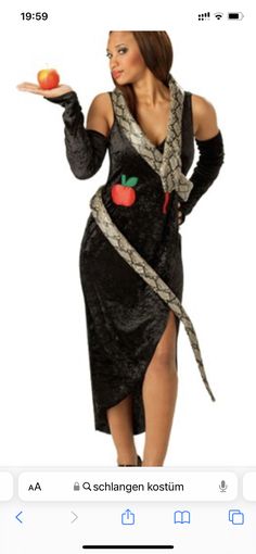 a woman in a costume holding an apple