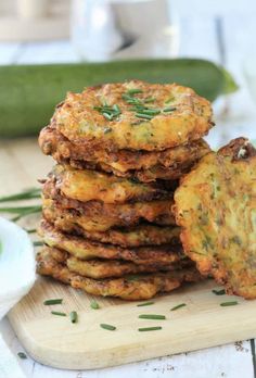 a stack of food sitting on top of a wooden cutting board