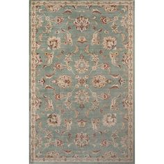 a light blue rug with an ornate design on the front and back side, in various colors