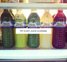 a refrigerator filled with lots of different types of juice