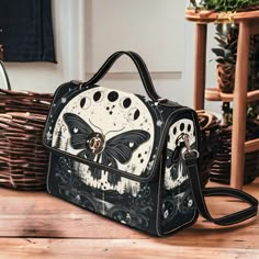 "Cottagecore Moth and Moon Phases Canvas Satchel Bag, Witch Moon Phases Crossed body vegan leather strap hand bag, goth bag hippies boho gift  >>PRODUCT INFO<< * 18.94 Oz. Made from high-grade waterproof canvas, durable, water-resistant. * Can be used as a nice laptop storage bag, business briefcase, college school bag, leisure travel tote bag, crossbody messenger bag, card wallet case, etc. * Two interior pockets for small items one zipper pocket. * Removable and adjustable shoulder strap. * Th Vintage Black Shoulder Bag For Festival, Gothic Black Shoulder Bag For Festivals, Gothic Shoulder Bag With Adjustable Strap For Daily Use, Witch Moon Phases, Handbag Design Ideas, Witchy Purse, Witch Bag, Goth Bag, College School Bag