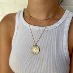 Buy in 14K Gold. A sweet and sunny hand-stamped necklace! This Large pendant measures approximately 1" in diameter. Shop the Small pendant. Shop MIMOSA's You Are My Sunshine Collection. Made by hand in our South Louisiana studio.Each piece varies slightly due to its handmade nature. *Note: Sterling Silver and 14K Gold prices may vary due to fluctuation in the gold and silver markets. Bohemian Silver Custom Pendant Necklace, Silver Medallion Necklace With Sun Design, You Are My Sunshine Necklace, Sterling Silver Sun And Moon Pendant Charm Necklace, You Are My Sunshine Necklace Pendants, Silver Market, Heart Shaped Candy, Sunshine Necklace, Hand Stamped Necklace