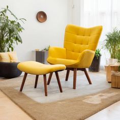 a living room with yellow chairs and plants