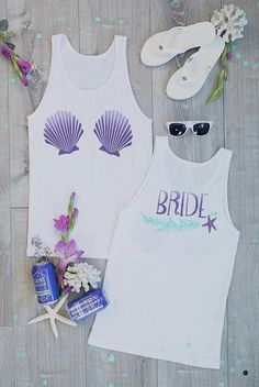 the bride and groom tank tops are next to their flip flops, starfish sandals, and flowers