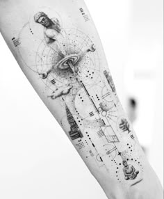 a person with a black and white tattoo on their arm