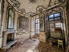 an old room with peeling paint on the walls