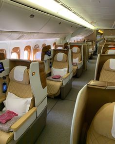 the inside of an airplane with many seats