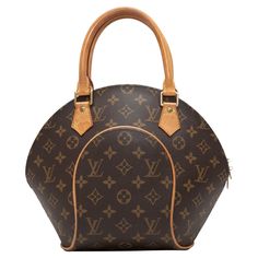 Brown Louis Vuitton Monogram Ellipse PM Bag. The Ellipse PM Bag features a monogram coated canvas body, gold-tone hardware, leather trim throughout, dual rolled top handles, and a top zip closure. 13.5" L x 11" H x 7" D, 6" handle drop. Louis Vuitton Epi Mabillon Backpack, Brown Designer Monogram Bag, Louis Vuitton Brown Bag, Sac Louis Vuitton, Louis Vuitton Shoulder Bag Vintage, Louis Vuitton 2000s Bag, Top Handle, New Wardrobe, Stuart Weitzman