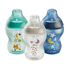 three baby bottles with different designs on them