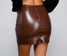 Get wrapped in this cute mini skirt that slays! The skirt features a high-rise waist. ruching. and a mini length with a wrap-style hem. The skirt is composed of a lined faux leather fabric that offers a form hugging fit with a moderate stretch. Complete look with a bustier and heels.Fit & Features High rise waist Ruching Mini length Wrap-style hem Faux leather fabric Form hugging fit. moderate stretch Runs true to size Cute Mini Skirt, Homecoming Outfits, Faux Leather Mini Skirt, Leather Mini Skirt, Glitter Dress, Cropped Blazer, Faux Leather Fabric, Selling Clothes, Maxi Dresses Casual