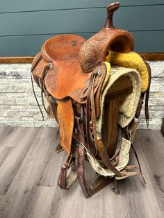 there is a saddle that has been placed on the floor