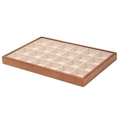 an empty wooden tray with twelve compartments