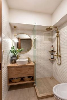 a bathroom with a sink, mirror and shower stall in it's corner next to a bathtub